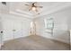 Spacious bedroom with double doors and a ceiling fan at 315 Brandenburgh Cir, Roswell, GA 30075