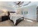 Comfortable bedroom with carpeted floor, ceiling fan, and window at 315 Brandenburgh Cir, Roswell, GA 30075