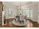 Bright dining room with hardwood floors, a charming table, and built-in window seat at 315 Brandenburgh Cir, Roswell, GA 30075