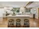 Spacious kitchen island with seating, quartz countertops and hardwood floors at 315 Brandenburgh Cir, Roswell, GA 30075