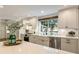 White kitchen with stainless steel appliances and farmhouse sink at 315 Brandenburgh Cir, Roswell, GA 30075