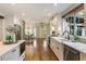 Modern kitchen with white cabinets, stainless steel appliances, and hardwood floors at 315 Brandenburgh Cir, Roswell, GA 30075