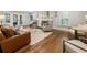 Living room with hardwood floors, fireplace, and French doors at 315 Brandenburgh Cir, Roswell, GA 30075