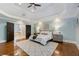 Spacious main bedroom with hardwood floors, tray ceiling, and ensuite bathroom at 315 Brandenburgh Cir, Roswell, GA 30075