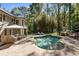 Freeform pool surrounded by a brick patio at 315 Brandenburgh Cir, Roswell, GA 30075