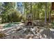 Relaxing pool and patio area with stone fireplace at 315 Brandenburgh Cir, Roswell, GA 30075