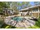 Inviting kidney-shaped pool surrounded by a spacious patio at 315 Brandenburgh Cir, Roswell, GA 30075