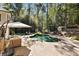 Relaxing kidney-shaped pool with ample patio space at 315 Brandenburgh Cir, Roswell, GA 30075