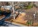 House sits on a large lot with mature trees and road frontage at 3542 N Druid Hill Rd, Decatur, GA 30033