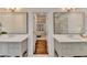 Luxurious bathroom with dual vanities and a doorway view into the main bedroom at 135 Shadow Creek Chase, Alpharetta, GA 30022