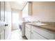 Bright laundry room with washer, dryer, and cabinets at 431 Wallis Farm, Marietta, GA 30064