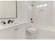 Clean bathroom, white tile, and black accents at 1103 Church Nw St, Atlanta, GA 30318