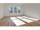 Sunlit bedroom with hardwood floors and multiple windows at 1103 Church Nw St, Atlanta, GA 30318