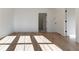 Sunlit bedroom with hardwood floors and access to other rooms at 1103 Church Nw St, Atlanta, GA 30318