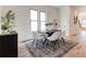 Modern dining area with round table, neutral chairs, and hardwood floors at 1103 Church Nw St, Atlanta, GA 30318