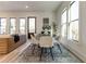 Bright dining room with round table, chairs, and access to deck at 1103 Church Nw St, Atlanta, GA 30318