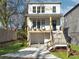 Two-story white house with front porch, driveway, and landscaped lawn at 1103 Church Nw St, Atlanta, GA 30318