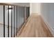 Hardwood floor hallway with modern railing at 1103 Church Nw St, Atlanta, GA 30318