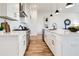 Modern kitchen with white cabinets, quartz countertops and stainless steel appliances at 1101 Church Nw St, Atlanta, GA 30318