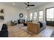 Living room features hardwood floors, a ceiling fan, and access to a deck at 1103 Church Nw St, Atlanta, GA 30318