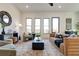 Spacious living room with hardwood floors, large windows, and comfortable seating at 1103 Church Nw St, Atlanta, GA 30318