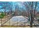 Tennis court with playground and trees at 1101 Church Nw St, Atlanta, GA 30318