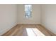 Charming bedroom with hardwood floors and a window overlooking the street at 1103 Church Nw St, Atlanta, GA 30318