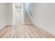 Light hallway with light hardwood floors and staircase at 1103 Church Nw St, Atlanta, GA 30318