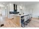 Modern kitchen with white cabinets, island, and hardwood floors at 1103 Church Nw St, Atlanta, GA 30318