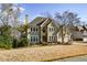 Two story house with stone accents and three car garage at 4720 W Forest Peak Ne, Marietta, GA 30066