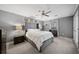Comfortable bedroom with ceiling fan and window at 1214 Highland Bluff Se Dr # 214, Atlanta, GA 30339