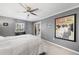 Serene bedroom with large window and ceiling fan at 1214 Highland Bluff Se Dr # 214, Atlanta, GA 30339