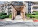 Elegant condo entry with covered walkway and stone details at 1214 Highland Bluff Se Dr # 214, Atlanta, GA 30339