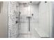 Spa-like shower with geometric tile and built-in seat at 1214 Highland Bluff Se Dr # 214, Atlanta, GA 30339