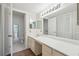 Bathroom with double vanity, large mirror, and ample storage at 174 Amherst Pl, Atlanta, GA 30327