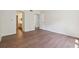 Large bedroom with hardwood floors and access to bathroom at 174 Amherst Pl, Atlanta, GA 30327