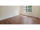 Well-lit bedroom with hardwood floors and large window at 174 Amherst Pl, Atlanta, GA 30327