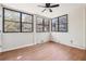 Sunroom with hardwood floors and multiple windows at 174 Amherst Pl, Atlanta, GA 30327