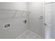 Functional laundry room with shelving and hookups at 3561 Glen Summit Ln, Snellville, GA 30039