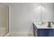 Bathroom featuring a vanity with white countertop and shower with glass doors at 4233 Creekrun Cir, Buford, GA 30519