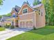 Charming two-story home with a well-manicured lawn and a convenient two-car garage at 4233 Creekrun Cir, Buford, GA 30519