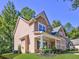 Well-maintained two-story home featuring attractive siding and a welcoming front porch at 4233 Creekrun Cir, Buford, GA 30519