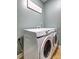 Laundry room featuring a stacked washer and dryer with tile flooring at 4233 Creekrun Cir, Buford, GA 30519