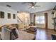 Spacious living room with L-shaped sectional sofa and large windows at 4233 Creekrun Cir, Buford, GA 30519