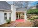 Outdoor patio leading to a garden with mature trees at 620 Oakledge Nw Dr, Marietta, GA 30060