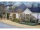 Back exterior of a home with a covered patio and landscaped garden at 620 Oakledge Nw Dr, Marietta, GA 30060