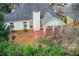 Aerial view of a backyard featuring a patio and lush greenery at 620 Oakledge Nw Dr, Marietta, GA 30060
