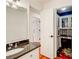 Bathroom with granite countertop vanity, and views to a hallway and a desk nook at 620 Oakledge Nw Dr, Marietta, GA 30060