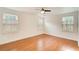 Spacious bedroom featuring neutral paint, hardwood flooring, and bright windows at 620 Oakledge Nw Dr, Marietta, GA 30060