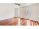 A spacious bedroom featuring hardwood floors, bright windows, and neutral walls at 620 Oakledge Nw Dr, Marietta, GA 30060